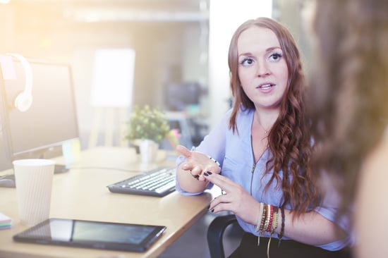 A woman teacher coaching another teacher