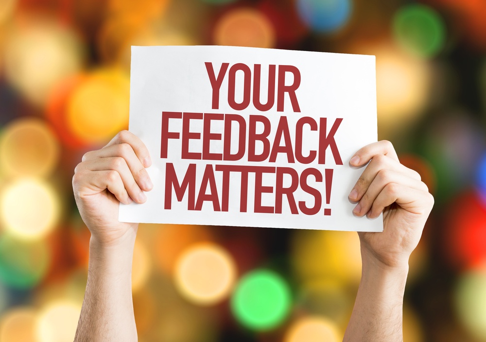Your Feedback Matters placard with bokeh background