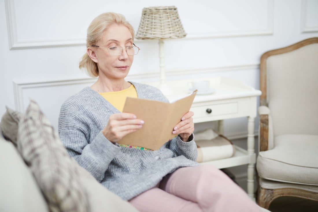 Woman Reading CPD book at home