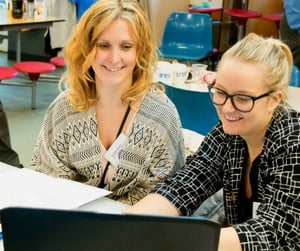 female-teachers-collaborate-with-laptop-iris-connect.jpg